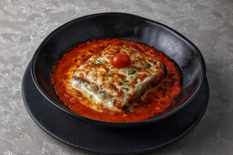 Baked lasagna with meat sauce and melted cheese